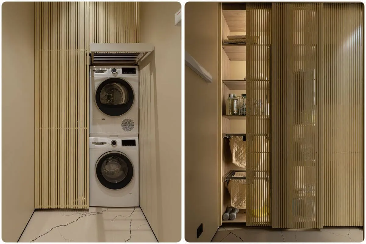 Технічне приміщення з пральною зоною і системами зберігання приховані за дерев’яними рейковими дверима